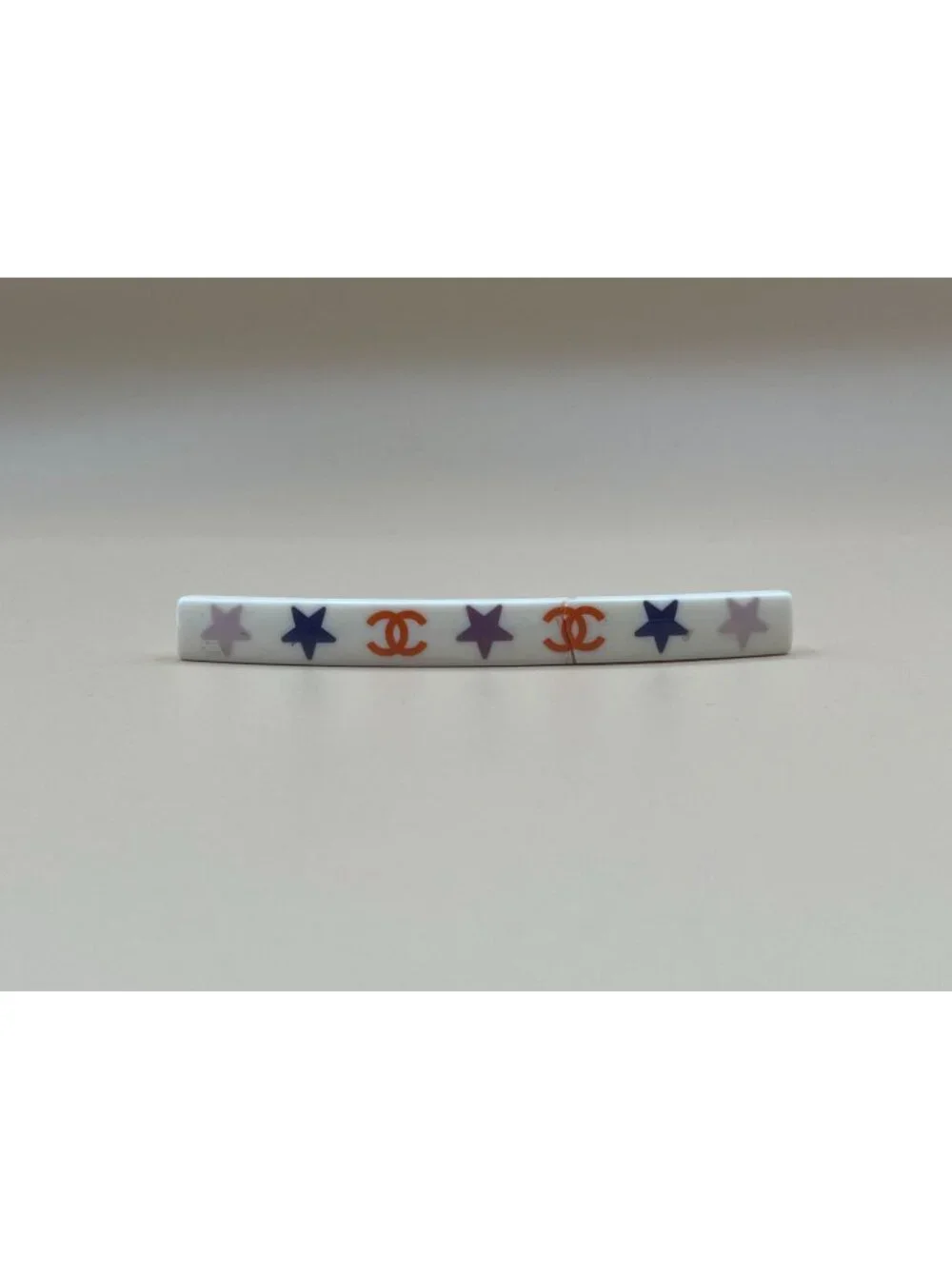 Authentic vintage Chanel bar barrette in cream-white resin, printed with two red